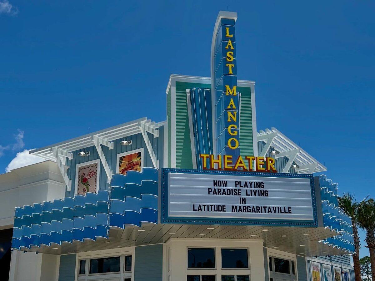 Custom-fabricated Last Mango Theater marquee and blade sign with neon, aluminum trellis, and tension banner frames at Latitude Margaritaville Watersound, FL — by CG Signs