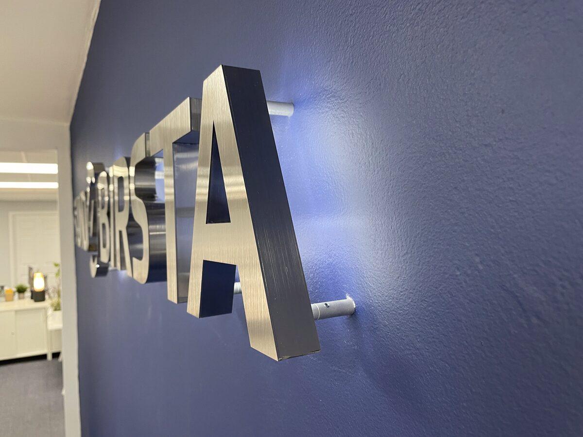 Cast aluminum dimensional letters with LED halo lighting — CG Signs