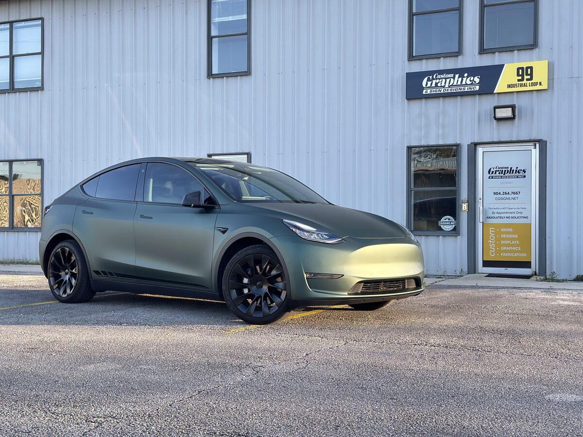 Matte Pine Green Metallic vehicle wrap on Tesla Model Y by CG Signs, Orange Park FL