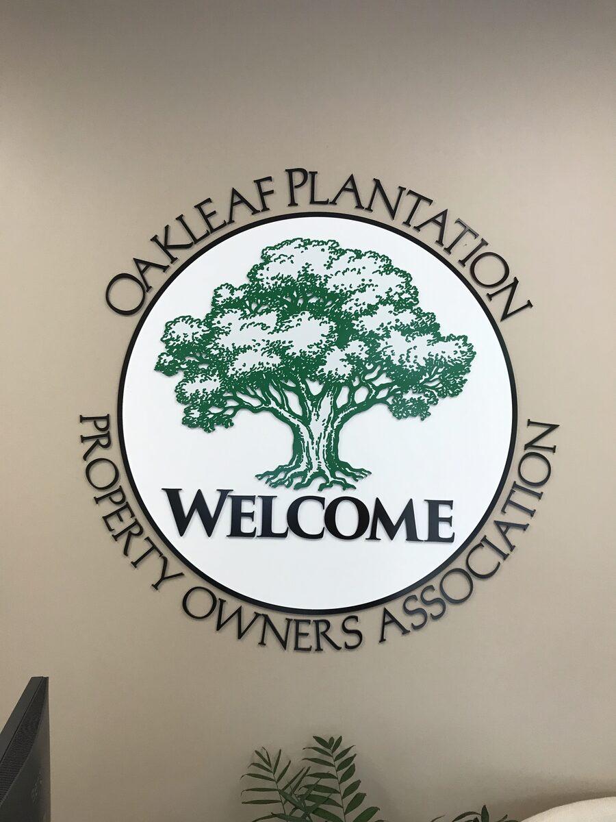 Acrylic dimensional letters and logo applied to interior wall — Custom Graphics & Sign Designs