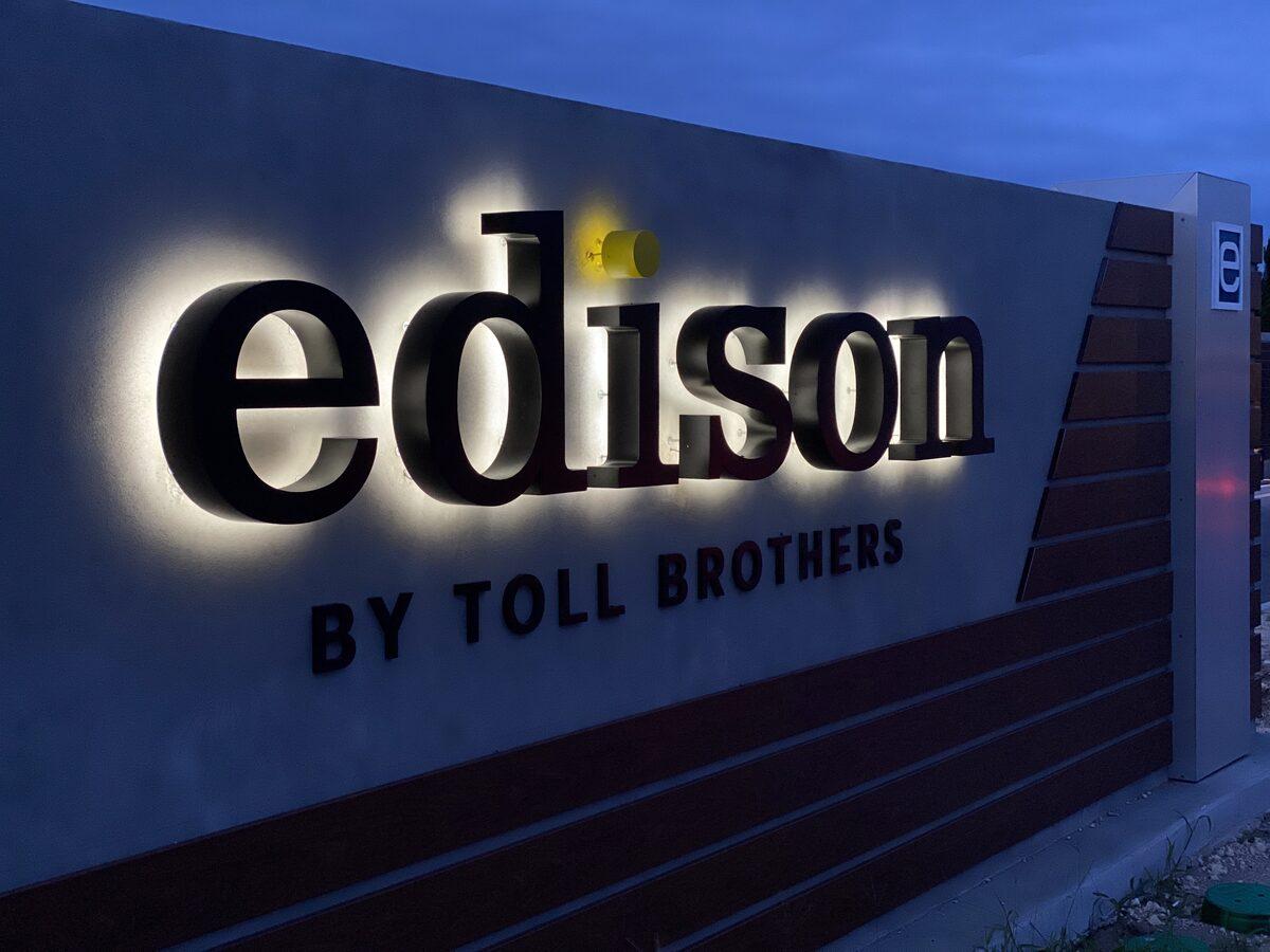 Night view of the halo-lit reverse channel letters for Edison by Toll Brothers at eTown — Custom Graphics & Sign Designs Jacksonville FL