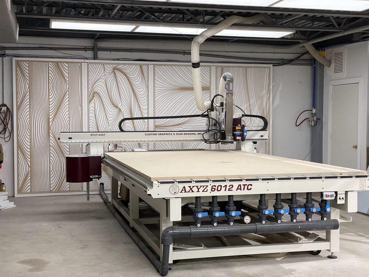 CNC router table at Custom Graphics & Sign Designs fabrication facility in Orange Park FL