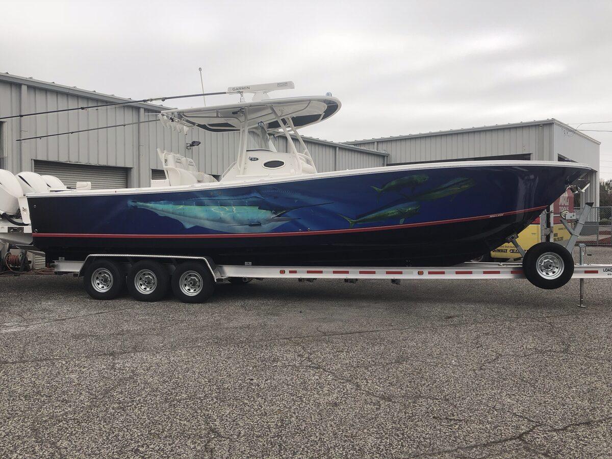 Custom boat wrap with underwater fish graphics by CG Signs, Jacksonville FL