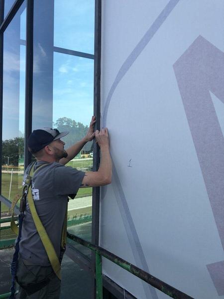 Installation of Perforated Window film at BestBet in Orange Park — Custom Graphics & Sign Designs
