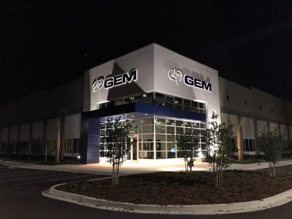 Nighttime view of Fabricated Aluminum Channel Letters with LED Halo Illumination for GEM Products — Custom Graphics & Sign Designs, Jacksonville FL