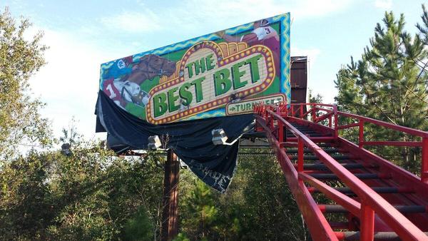 Removal of a billboard face reveals the custom printed billboard we installed for BestBet in the '90's — Custom Graphics & Sign Designs, Jacksonville FL
