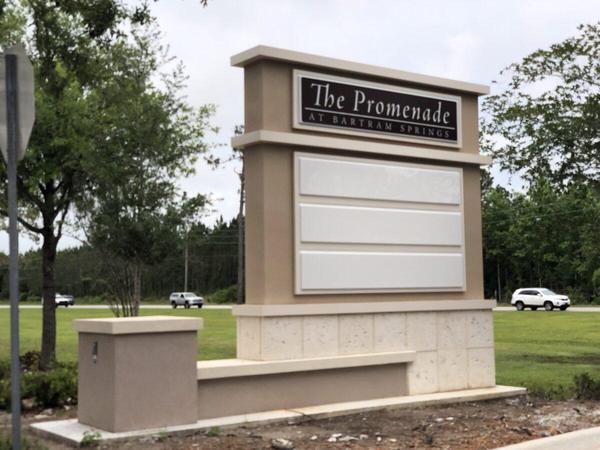 Custom fabricated, internally illuminated, aluminum monument sign with stucco finish and cast stone accents — Custom Graphics & Sign Designs, Jacksonville FL