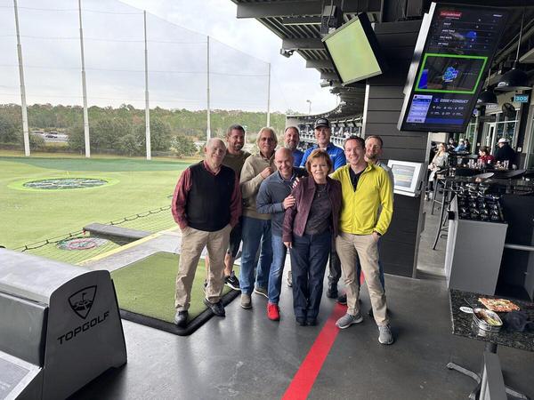 Group photo of the team at Top Golf during a holiday party — Custom Graphics & Sign Designs, Northeast Florida