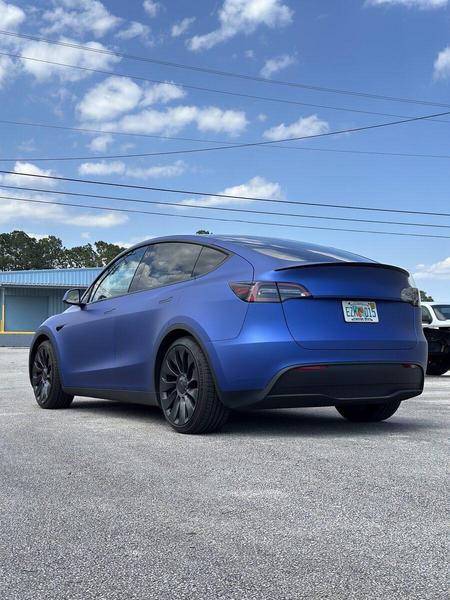 Matte Blue Metallic wrap on Tesla Model Y — Custom Graphics & Sign Designs, Jacksonville FL