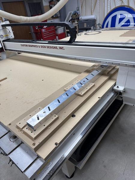 CNC cutting aluminum extrusion used for custom bahama shutters — Custom Graphics & Sign Designs, Northeast Florida
