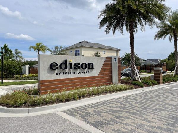 Custom Fabricated Monument Sign for Edison by Toll Brothers in eTown. Aluminum structure with concrete and stucco façade with Knotwood and Brushed aluminum accents. Halo-Lit reverse channel letters — Custom Graphics & Sign Designs
