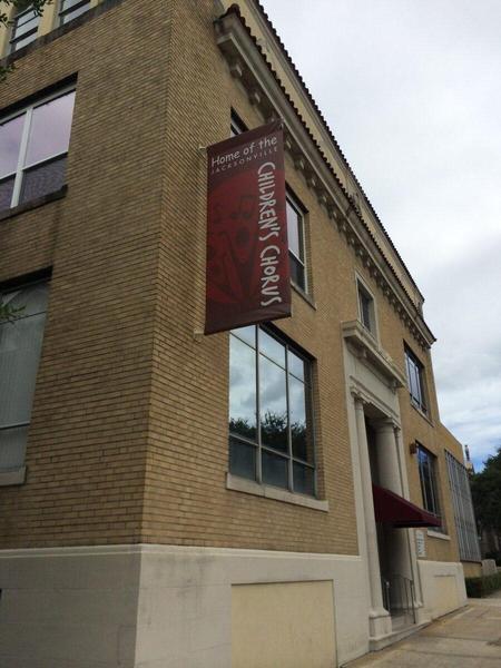 Custom pole banner for corner of a building in Downtown Jacksonville — Custom Graphics & Sign Designs