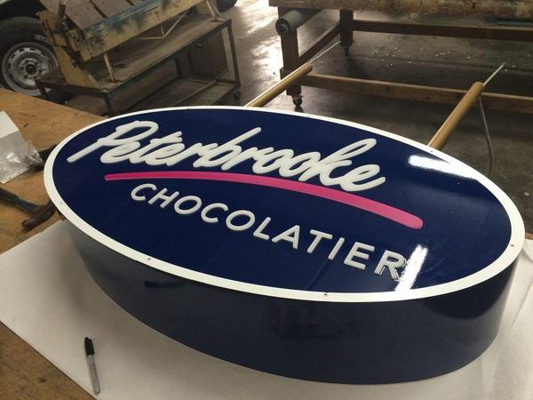 Fabricated Aluminum Cabinet with Push Through Acrylic for Peterbrooke Chocolatier — Custom Graphics & Sign Designs, Jacksonville FL