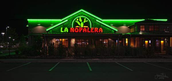 Nighttime view of halo-lit channel letters with green neon accent for La Nopalera Mexican Restaurant — Custom Graphics & Sign Designs, Jacksonville FL